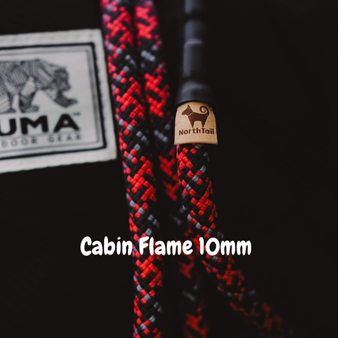 Cabin Flame 10mm climbing rope dog leash by North Tail — handmade in Ontario using genuine UIAA certified rope in red and black. Durable and designed for active dogs and outdoor adventures.