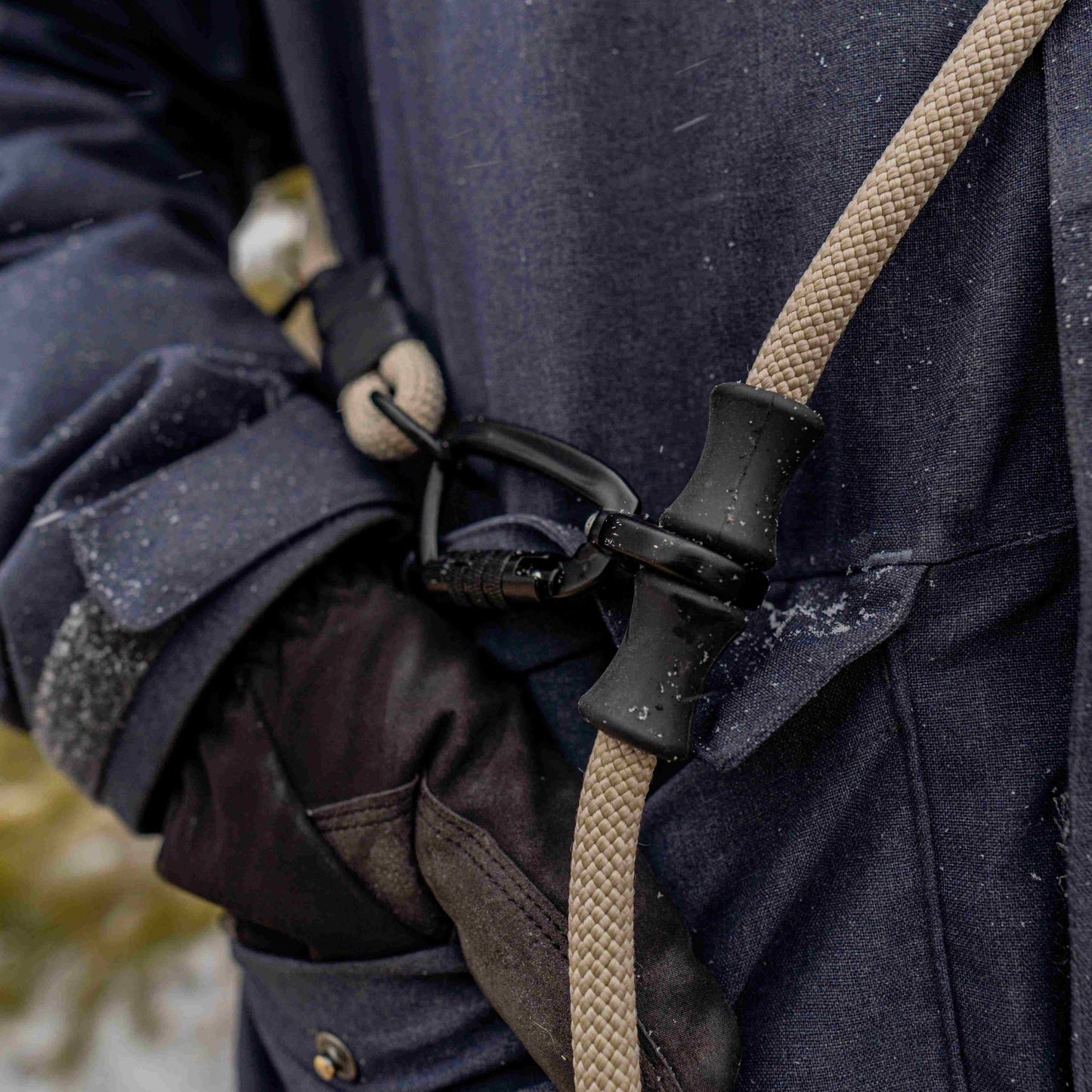 Adjustable leash worn over the shoulder, offering hands-free walking for active owners.