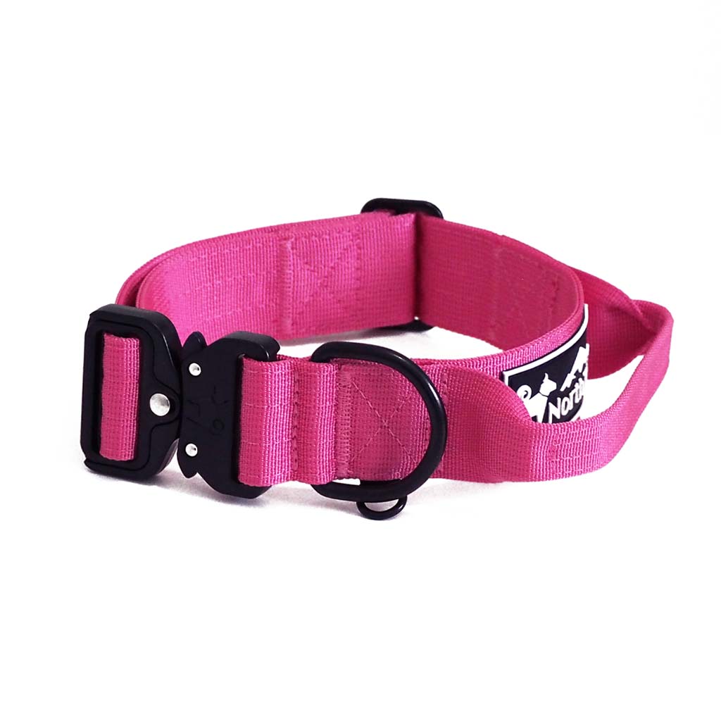 Pink North Tail dog collar for medium to large dogs, 1.5 inch wide, featuring a quick-grab handle and heavy-duty auto-locking buckle. Made with durable, easy-to-clean nylon belt, includes separate dog tag D-ring and weatherproof rubber logo. Designed for safety, longevity, and adventure-ready style.
